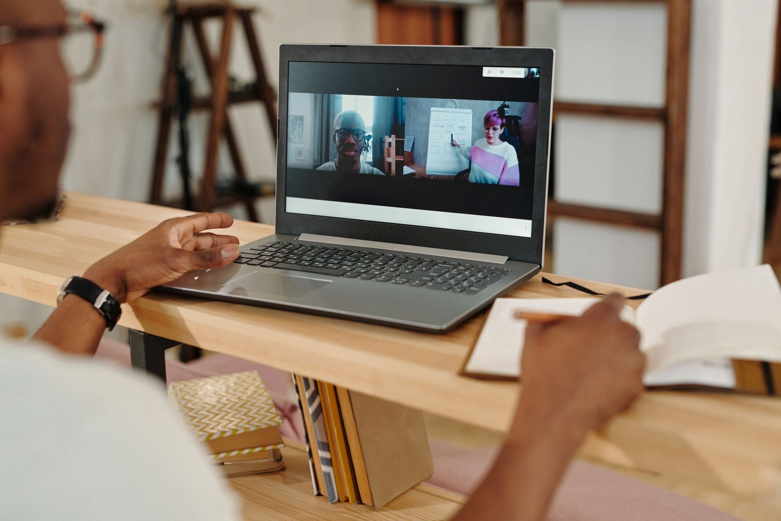 Professional taking notes during an online course, earning LEED continuing education hours